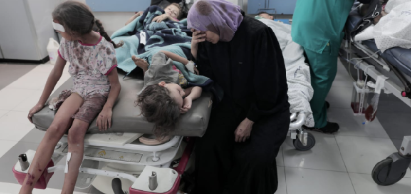 An injured child is treated at a hospital after an Israeli airstrike in Deir al-Balah, central Gaza Strip, 18 October