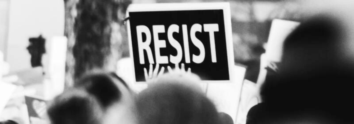 Protest sign saying "resist"