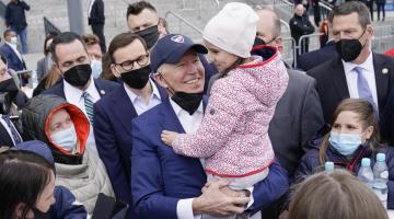 Biden holding a Ukrainian refugee child