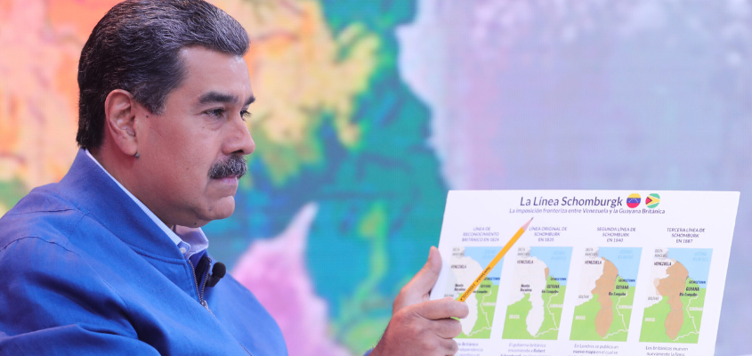 President Maduro holding up a map of Venezuela and the Essequibo region
